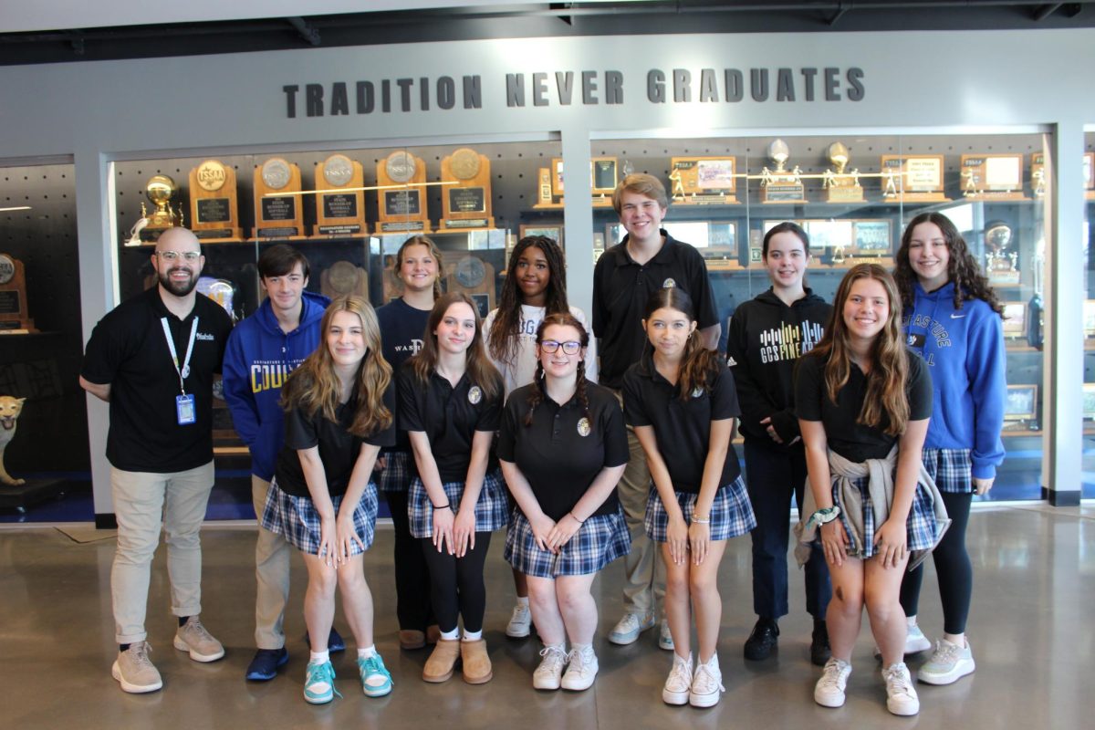 Mr. Zach Shockley and his fifth block chorus class take a break from class before performing for Veteran's Day.